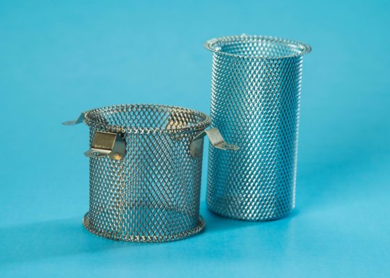 A pair of baskets are sitting on the floor.